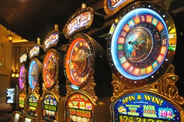 Starburst slot game interface showing five reels, jewel symbols, and expanding wild animation